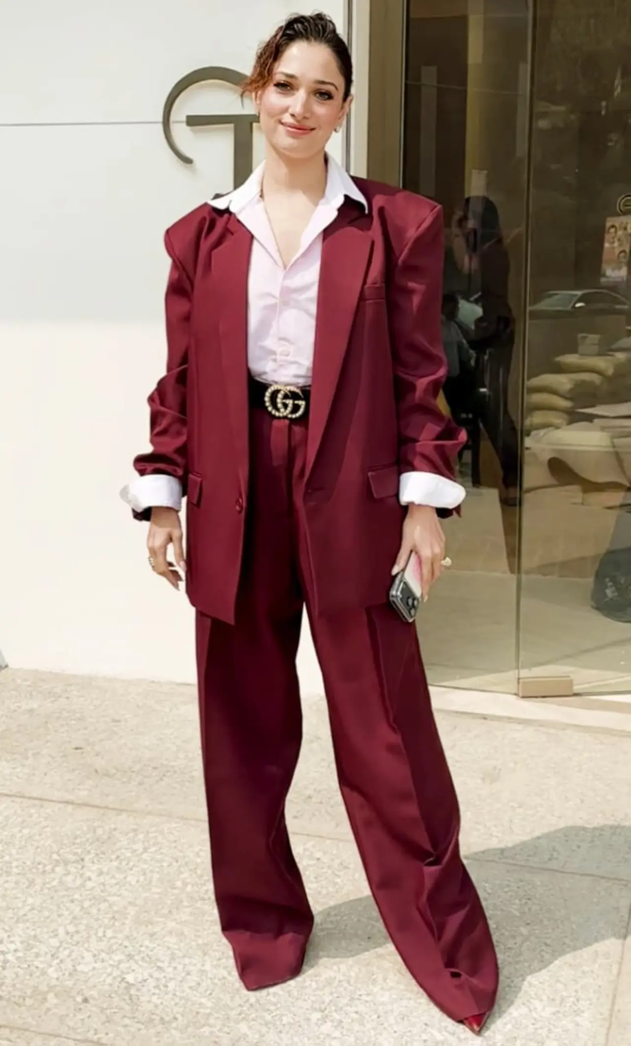 Tamannaah Bhatia exuded boss lady vibes as she was spotted at her jewellery store in the city, wearing a deep red pantsuit with white shirt.